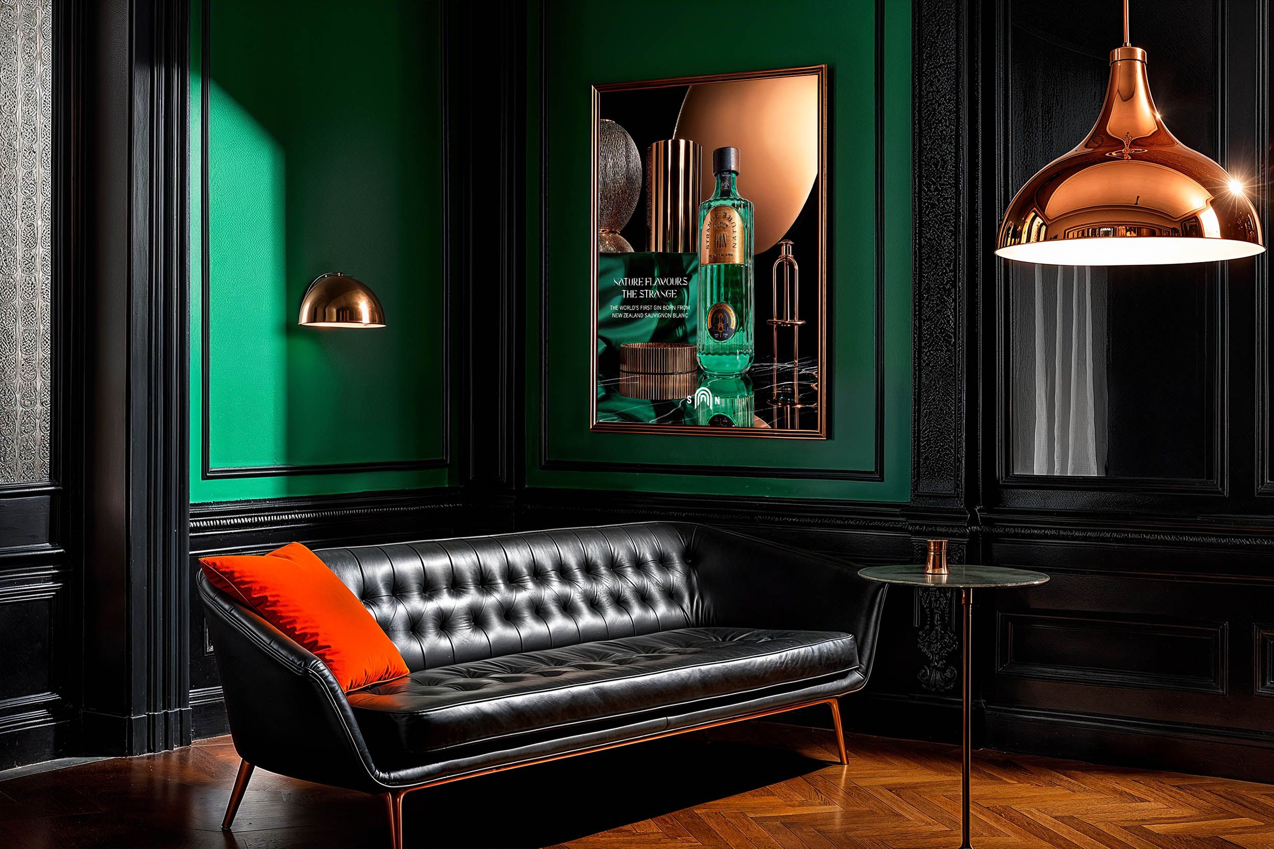 Framed Strange Nature campaign poster on the emerald wall of a dark cocktail bar with copper pendant lights — Chronos Studio.