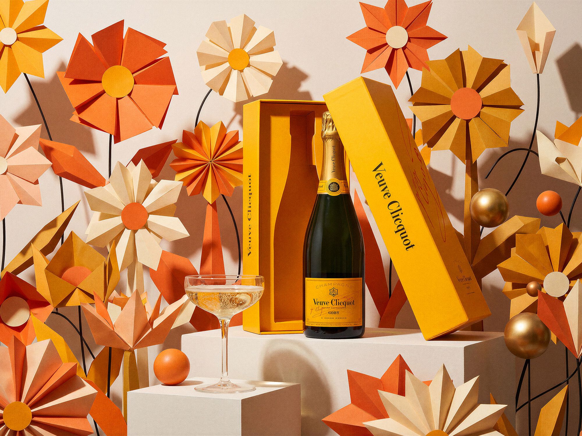 Veuve Clicquot Champagne bottle and coupe in a festive origami set, retouched by Chronos Studio.